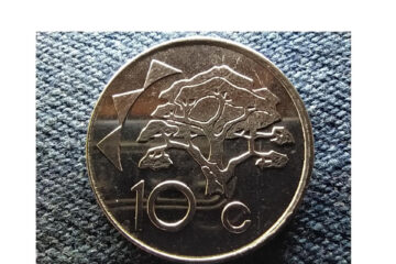 Ten cent coin under pressure
